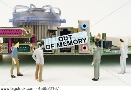 Technology And Computer Concept. Figures Of People Are Standing Near The Motherboard And Looking At 