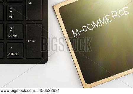 Sign Displaying M Commerce. Concept Meaning Commercial Transactions Conducted Electronically By Mobi