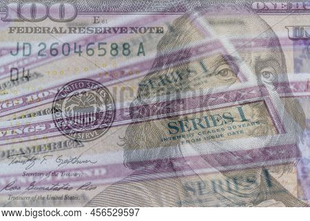 Us Savings Bonds With 100 Dollar Bill Overlay. Savings Bonds Are Debt Securities Issued By The U.s. 