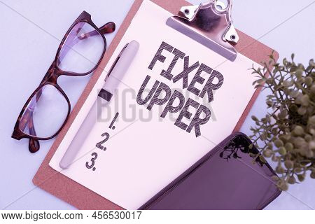Sign Displaying Fixer Upper. Word For House In Need Of Repairs Used Chiefly Connection With Purchase