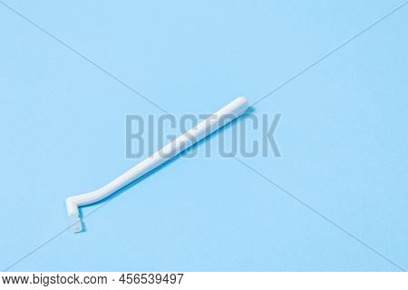 Orthodontic Toothbrush With One Bundle For Braces On A Blue Background Special Tool For Oral Care
