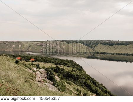 Houses On The Banks Of A Large River With Calm Water. Bakota Bay Rural View. The Landscape Of Dniest