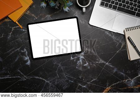 Top View Digital Tablet, Laptop Computer, Notepad And Coffee Cup On Marble Table.