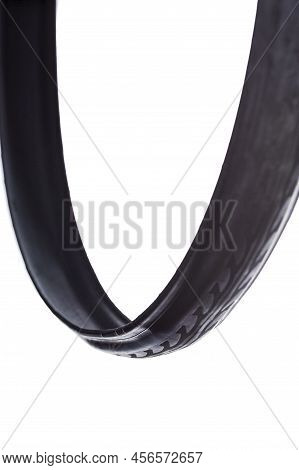 Closeup Of One New Road Bike Folded Tyre Placed Unfolded Free Over White Background. Vertical Shot