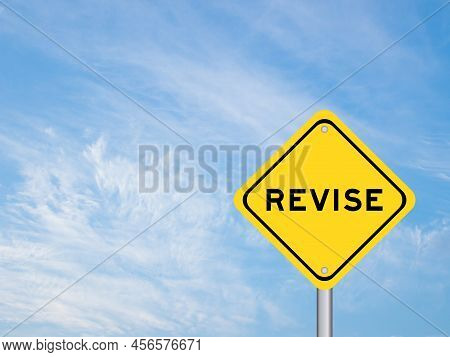 Yellow Transportation Sign With Word Revise On Blue Color Sky Background