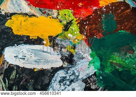 Bright Spots Of Paint In An Art Workshop