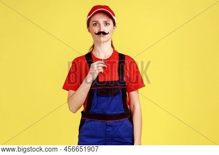 Portrait Of Funny Handy Woman Standing With Paper Mustache On Stick, Looking At Camera, Having Fun, 