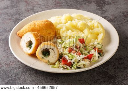 Ukrainian Dinner Chicken Kiev Cutlets Served With Salad And Mashed Potatoes Closeup In The Plate On 