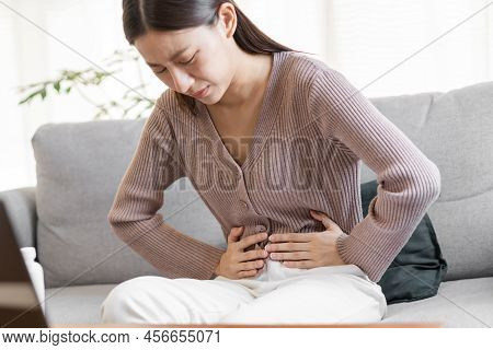 Flatulence Asian Young Woman, Girl Hand In Stomach Ache, Suffer From Food Poisoning, Abdominal Pain 
