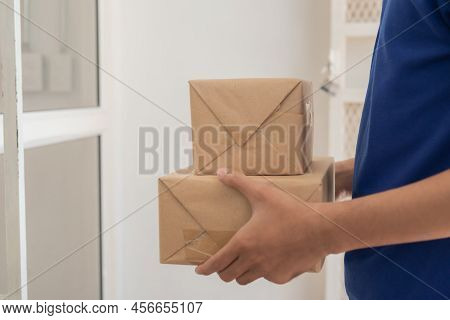 Delivery Man Employee, Postman Hold Cardboard Box,parcel Or Packet For Send To Client,customer In Bl