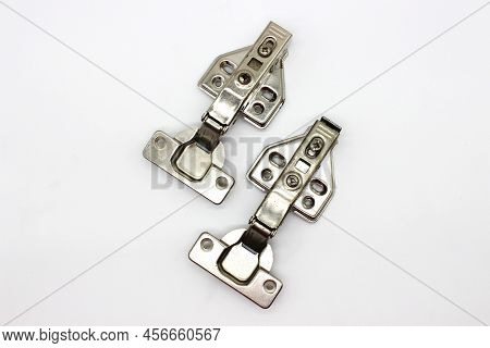 A Picture Of Stainless Steel Hydraulic Hinges With Selective Focus
