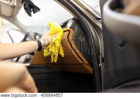 Close-up Of Male Hand Cleaning Vehicle Interior, Cleaner Washes Car Leather Salon. Cleaning Service,