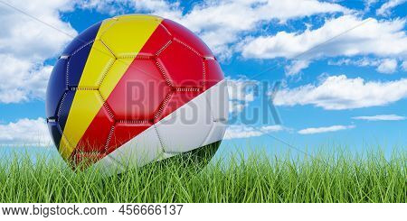 Soccer Ball With Seychelloise Flag On The Green Grass Against Blue Sky, 3d Rendering
