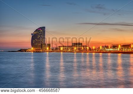 Barceloneta Beach In Barcelona With The Iconic Skyscraper After Sunset