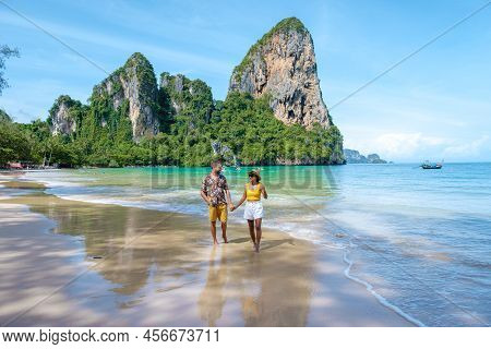 Railay Beach Krabi Thailand, The Tropical Beach Of Railay Krabi, A Couple Of Men And Woman On The Be