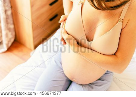 Breast Exam Cancer Pregnancy Woman Check. Happy Young Pregnant Woman Self Exam. Breast Self Exam. He