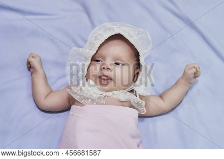 Newborn Baby Girl Sleep On Blue Blan. Close Up