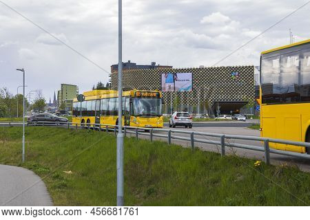 Close Up View Of Yellow City Busses On Uppsala Landscape View Background. Sweden. Uppsala. 06.19.202