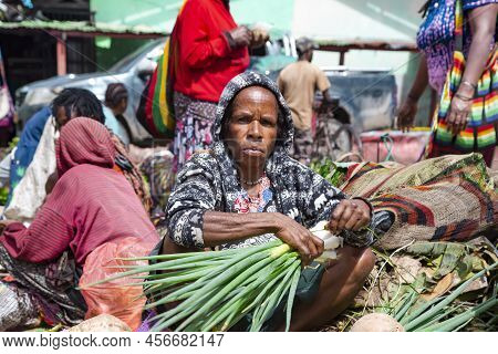 Indonesia, Papua New Guinea, Wamena, Irian Jaya, 20 August 2019: Papuans Woman Sell Greenery Vegetab