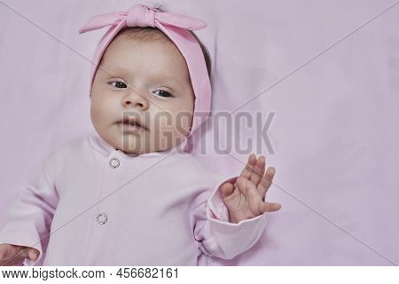 Newborn Baby Girl Sleep On Pink Blan. Close Up