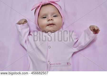 Newborn Baby Girl Sleep On Pink Blan. Close Up