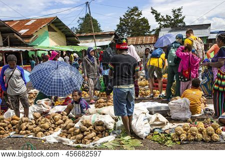 Indonesia, Papua New Guinea, Wamena, Irian Jaya, 20 August 2019: Papuans Woman Sell Sweet Potatoes A