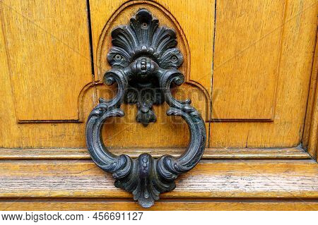 European Vintage Old Metal Wrought Iron Door Knocker. Design Detail. Paris.