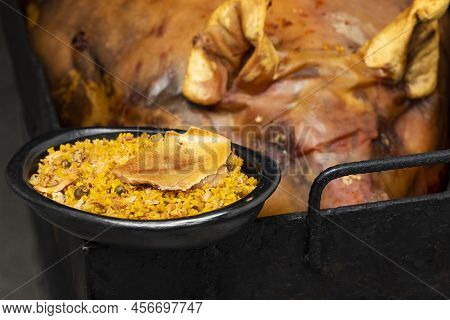 Typical Tolimense Lechona With Rice - Typical Colombian Dish