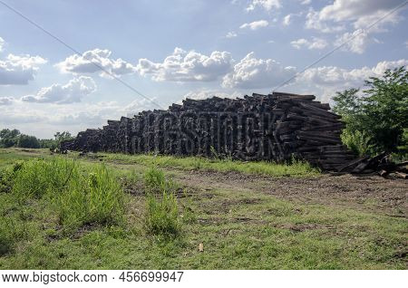 Larger Piles Of Stacked Used Wooden Railway Sleepers. Wooden Sleepers Are Better Than Other Railway 