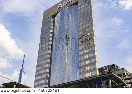 Kuala Lumpur, Malaysia - June 18. 2022: Menara Tower Reflecting In The Glass Façade Of The Aia Build