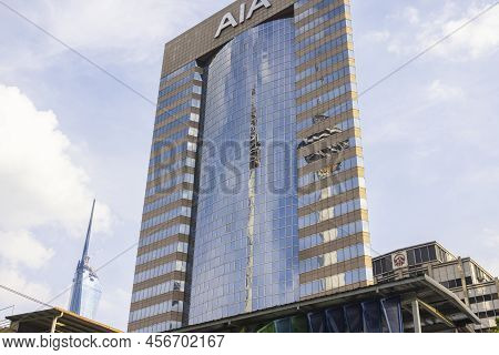 Kuala Lumpur, Malaysia - June 18. 2022: Menara Tower Reflecting In The Glass Façade Of The Aia Build