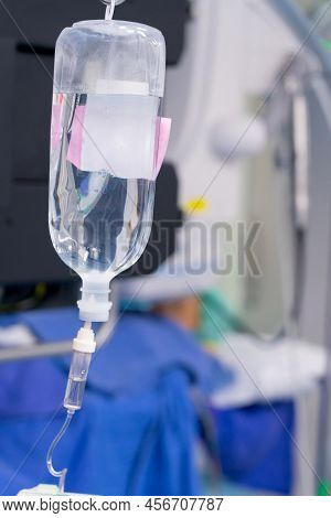 Normal Saline Solution Or Sodium Chloride With Infusion Bottle Drip For Patient In Hospital, Intrave