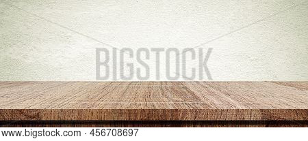 Wood Table And Brown Wall Background In Kitchen, Wooden Shelf, Counter For Food And Product Display 