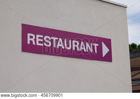 Restaurant Text Sign On Violet Purple Panel Board Facade Building City Street Storefront