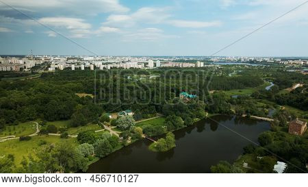 Flight Over The City Park. You Can See Park Buildings. Aerial Photography.