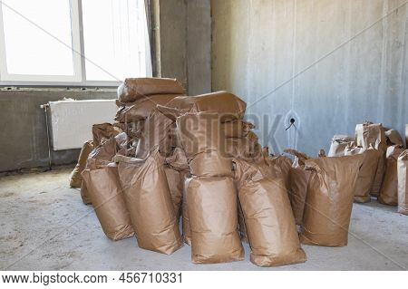 Cement Bagbuilding Mix Bags. Delivery Of Cement And Plaster For Works. Paper Bags With Cement And Bu
