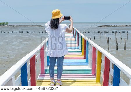 The Back View Of Asian Woman Standing And Tanking Photo On The Rainbow Bridge To See The Viewpoint A