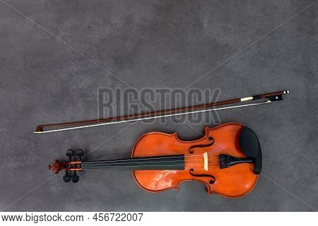 Violin And Bow On Gray Wood Background. Flat Lay, Top View, Copy Space. Concept Of Classical Music, 