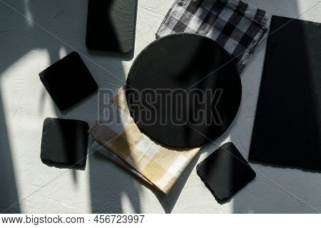 White Food Background With Empty Black Stone Boards. Free Space For Text Or Product. Top View