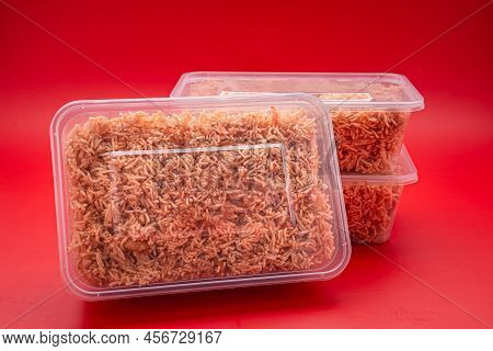 Boxes Of Sweet And Sour Crispy Noodles (or Mee Krob In The Thai Language) Placed On A Red Background