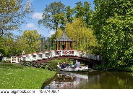 Frederiksberg, Denmark - May 07, 2022: People In A Rowboat In Frederiksberg Gardens.