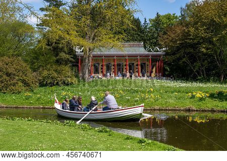 Frederiksberg, Denmark - May 07, 2022: People In A Rowboat In Frederiksberg Gardens.