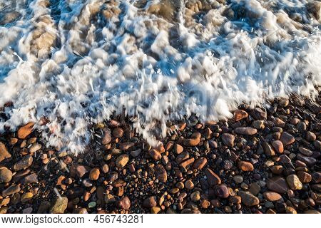 Small Red Pebbles Washed By Waves On A Beach In Las Flores, Maldonado, Uruguay