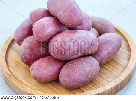 Raw Red Potatoes On The Wooden Tray