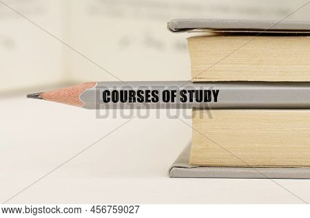 Education Concept. In The Book Between The Pages Lies A Pencil With The Inscription - Courses Of Stu