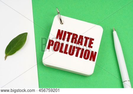 Ecological Concept. On A White-green Surface, A Piece Of Paper, A Pen And A Notepad With The Text - 