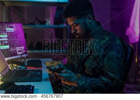 American Hacker In Military Unifrorm On Dark Web, Cyberwar Concept.
