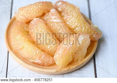 Pomelo Fruit On Wooden Plate, Fresh Pomelo Peeled Frome Pomelo Tree , Pummelo , Grapefruit In Summer
