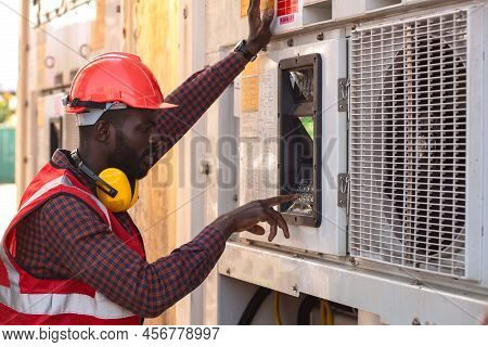 Engineer Control Reefer With Air Conditioner At Container Box.