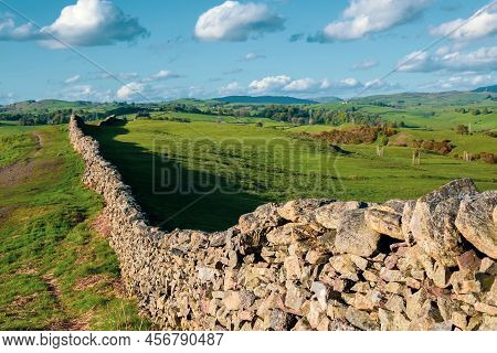 Malham Cove, A Huge Curving Amphitheatre Shaped Cliff Formation Of Limestone Rock In Yorkshire Dales